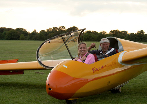 two people in a glider 